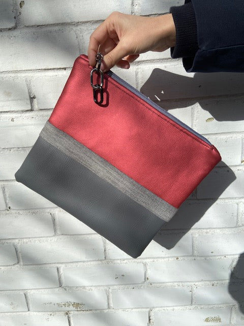 Grey faux leather, denim and metallic pink clutch bag