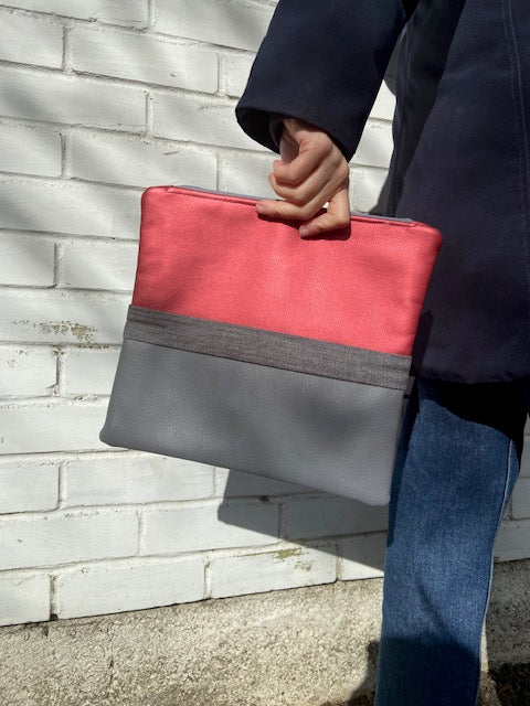 Grey faux leather, denim and metallic pink clutch bag