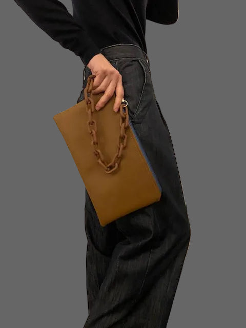 Double faced navy blue/brown clutch bag with a chain holder