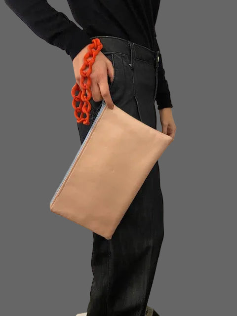 Double faced baby pink/green clutch bag with a chain holder