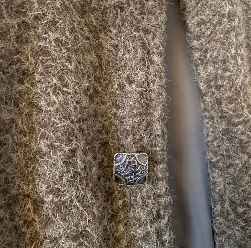 Vintage buttons on  a bronze lined gilet